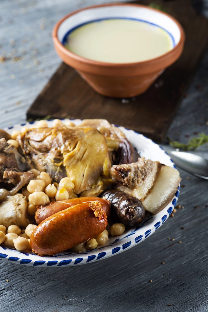 Cocido madrileño: chickpeas, meats and vegetables, with the broth served separately