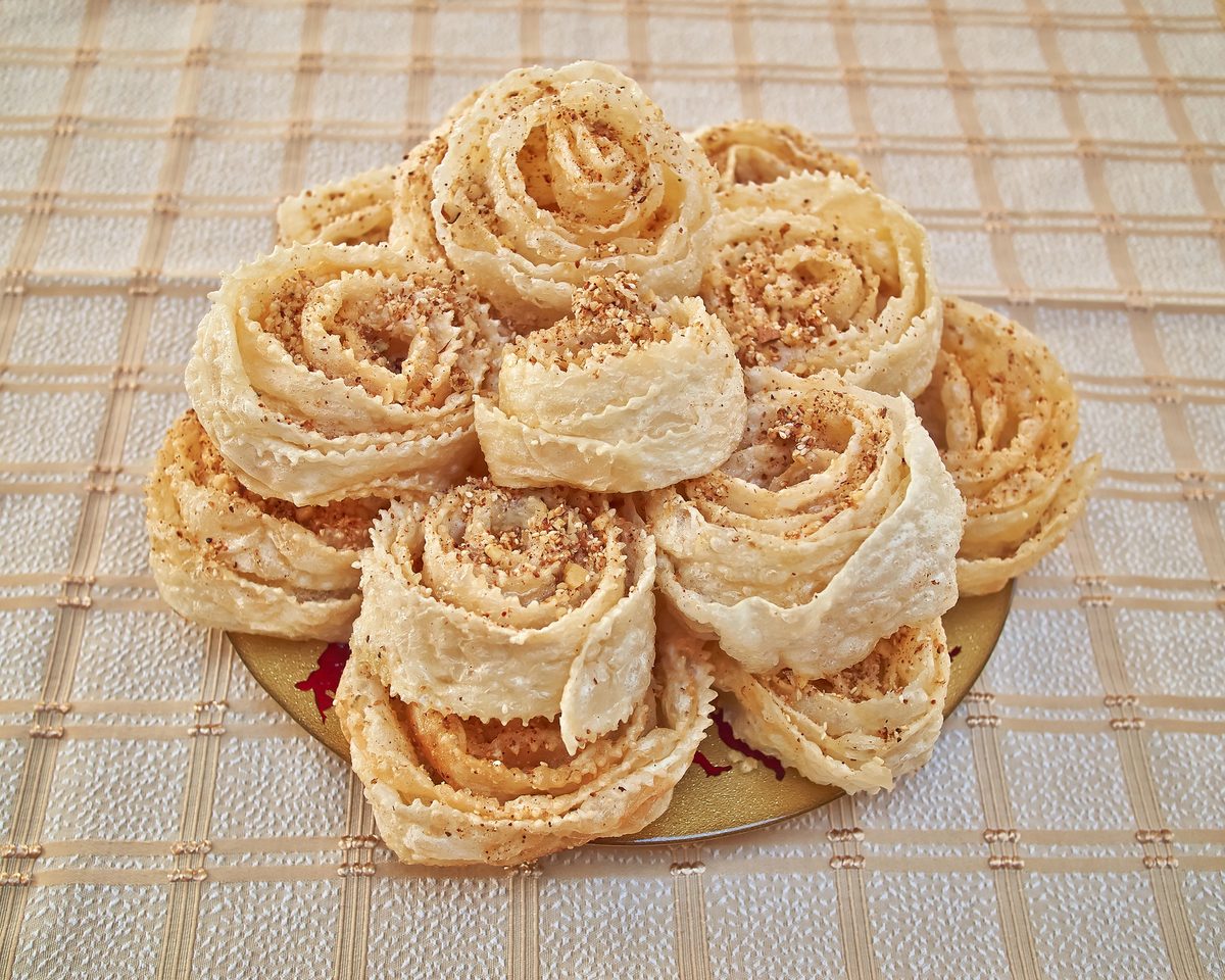Xerotigana, spiral fried pastries with honey syrup and nuts