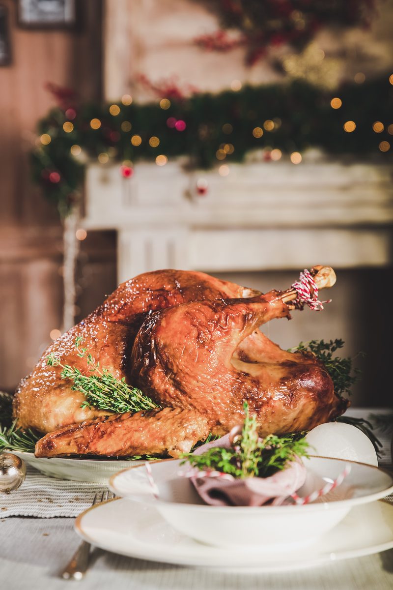 Roast turkey on a holiday table with Christmas decorations