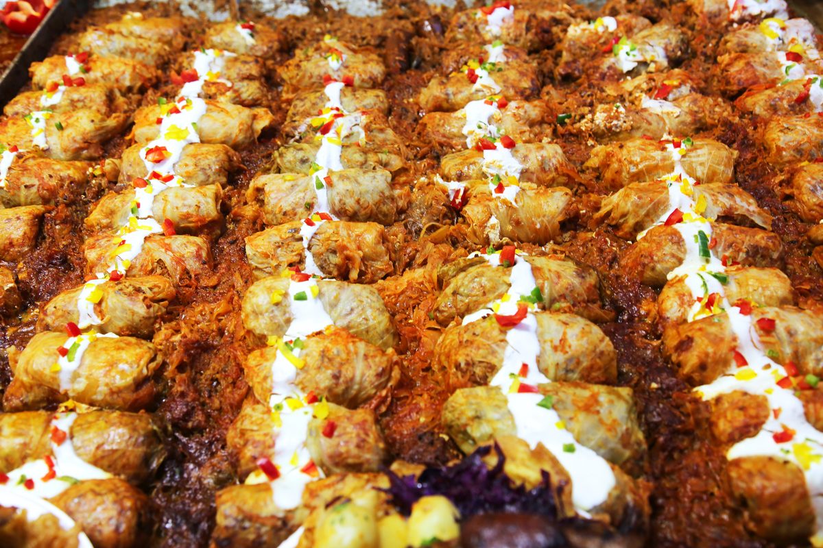 Rows of Hungarian stuffed cabbage rolls in a baking tray