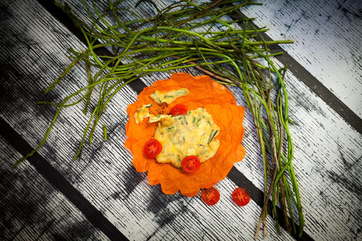 Wild asparagus omelet garnished with asparagus spears