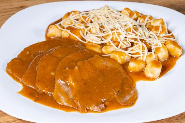 Pašticada, braised beef in a rich wine sauce, served with gnocchi