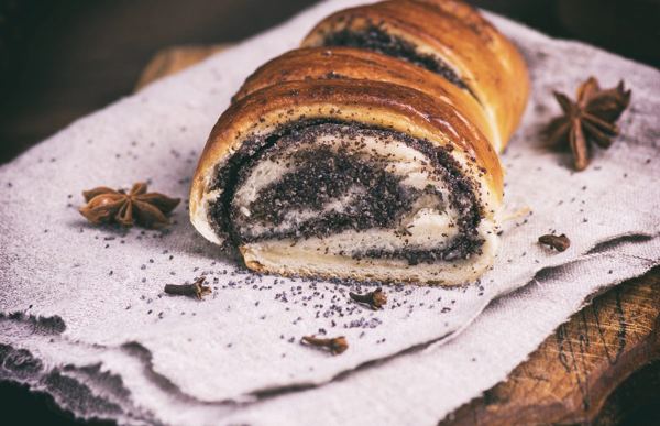 Makovnjača poppy seed roll, sliced on a board