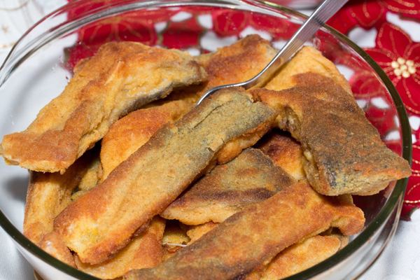 Breaded fried fish pieces in a glass bowl