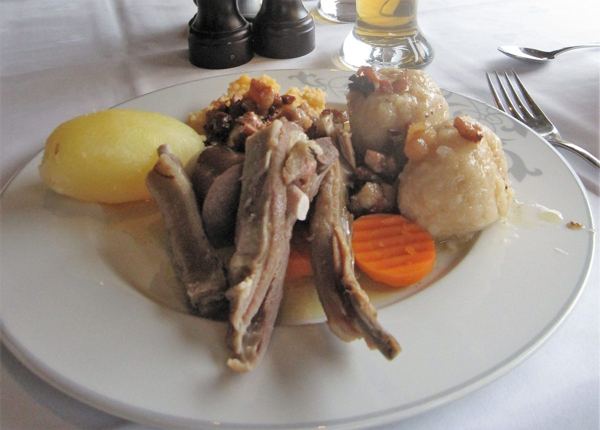 Pinnekjøtt, cured lamb ribs, with mashed rutabaga and potatoes on a plate