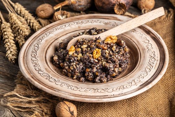 Kutia, wheat berries with poppy seeds, honey and nuts, in a ceramic bowl