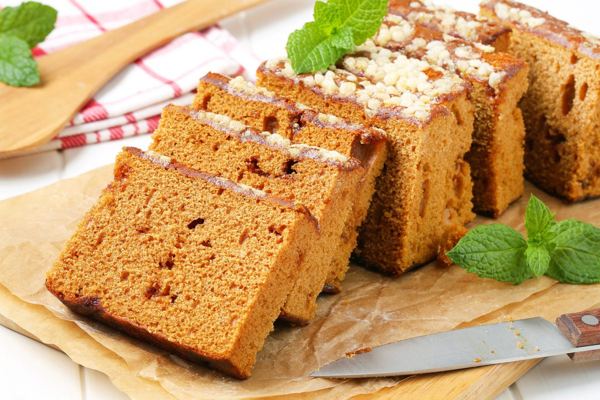 Slices of piernik, dark Polish honey spice cake, on a board