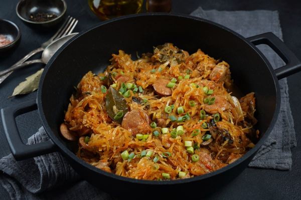 Bigos, hunter's stew of sauerkraut and meat, in a cast iron pan