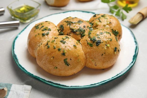 Pampushky, soft bread rolls brushed with garlic and herbs