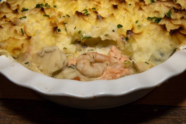 Fish and seafood pie topped with golden mashed potato