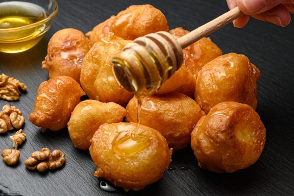 Loukoumades honey puffs drizzled with honey and walnuts